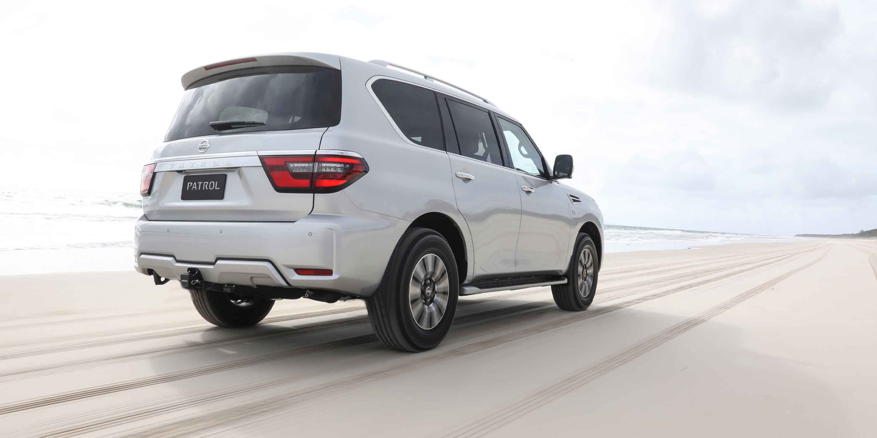 Nissan Patrol driving along beach