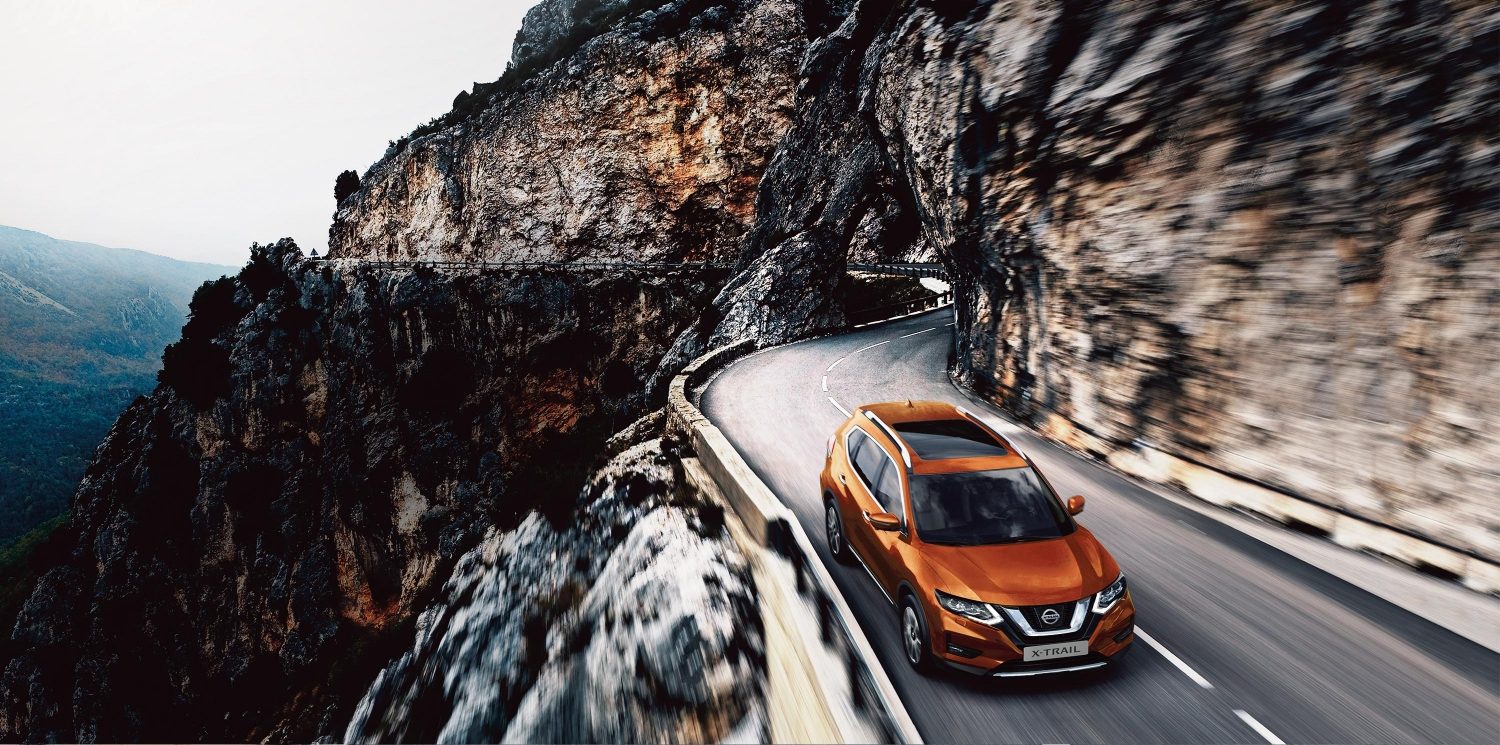 X-Trail 3/4 front high driving in the mountain - start